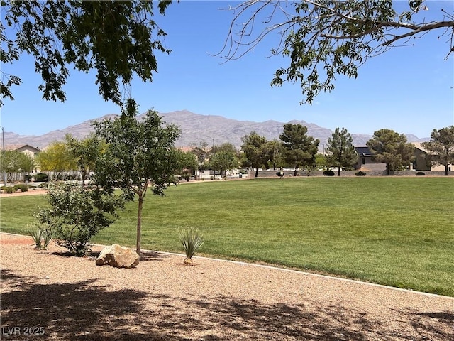 8301 Strawberry Spring St, Las Vegas, NV 89143 - view of property's community featuring a mountain view and a lawn