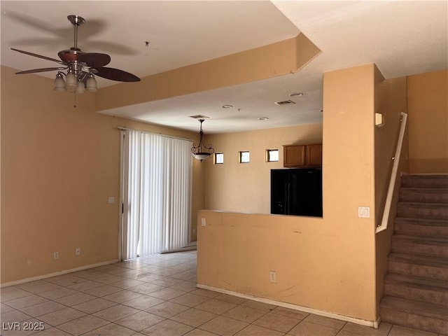 8301 Strawberry Spring St, Las Vegas, NV 89143 - empty room featuring ceiling fan, light tile patterned flooring, plenty of natural light, and stairs