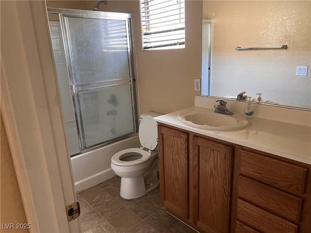 8301 Strawberry Spring St, Las Vegas, NV 89143 - full bath with toilet, vanity, shower / bath combination with glass door, and tile patterned flooring