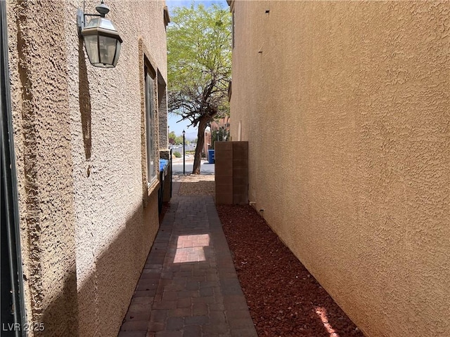 8301 Strawberry Spring St, Las Vegas, NV 89143 - view of side of property with stucco siding