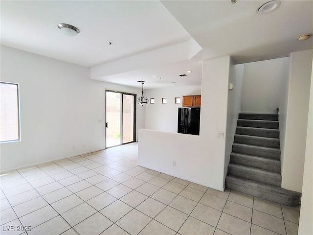 8301 Strawberry Spring St, Las Vegas, NV 89143 - unfurnished living room with stairway, light tile patterned floors, and a chandelier