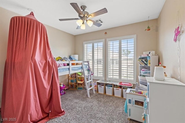 carpeted bedroom featuring visible vents and ceiling fan