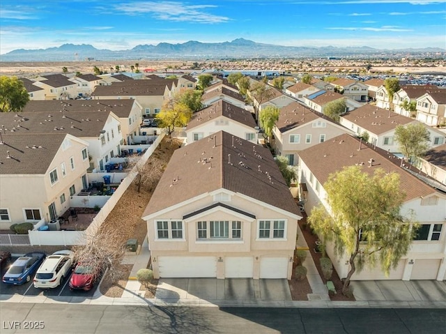 aerial view featuring a mountain view and a residential view