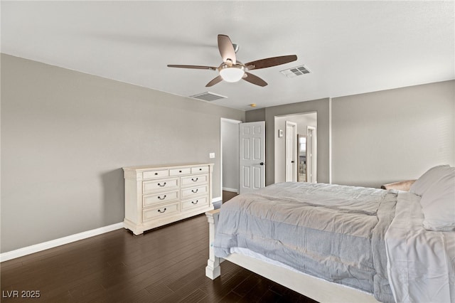 bedroom with dark wood-style floors, visible vents, and baseboards