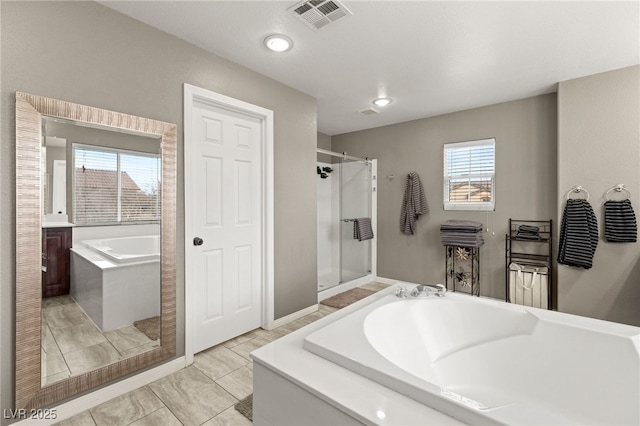 bathroom featuring a bath, recessed lighting, visible vents, and a stall shower