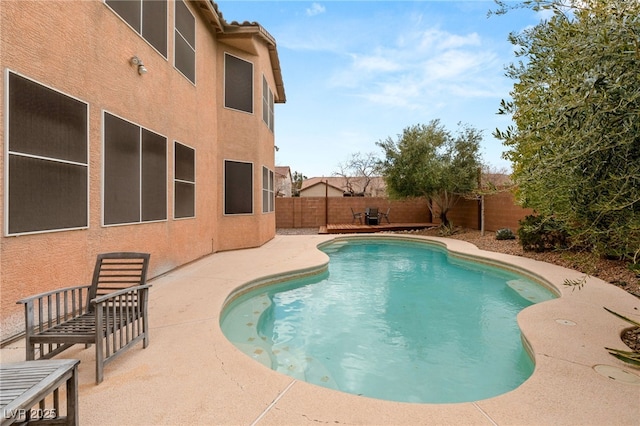 view of pool featuring a patio area, a fenced backyard, and a fenced in pool