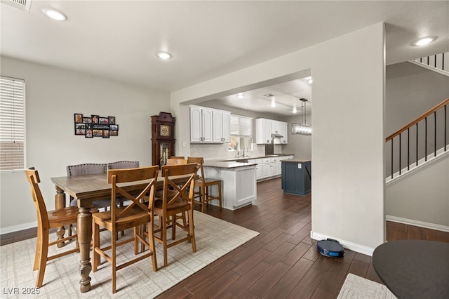 dining space featuring stairway, recessed lighting, dark wood-style floors, and baseboards