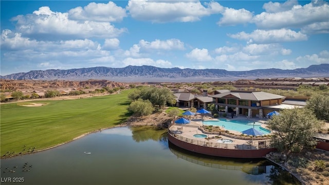 drone / aerial view featuring a water and mountain view