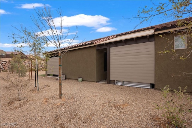 rear view of property with stucco siding