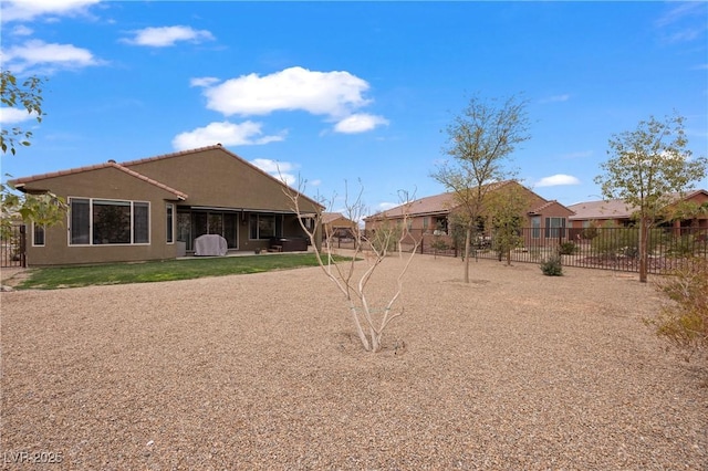 back of property with a patio area, fence, and stucco siding