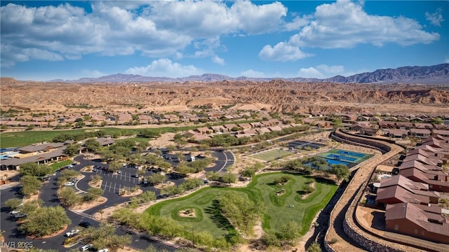 bird's eye view featuring golf course view and a mountain view