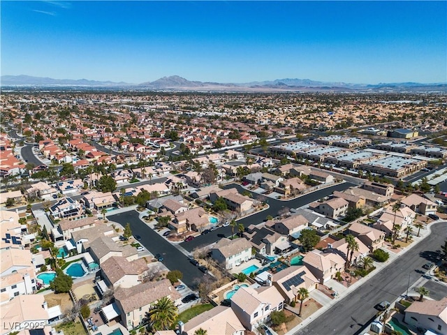 drone / aerial view featuring a mountain view and a residential view