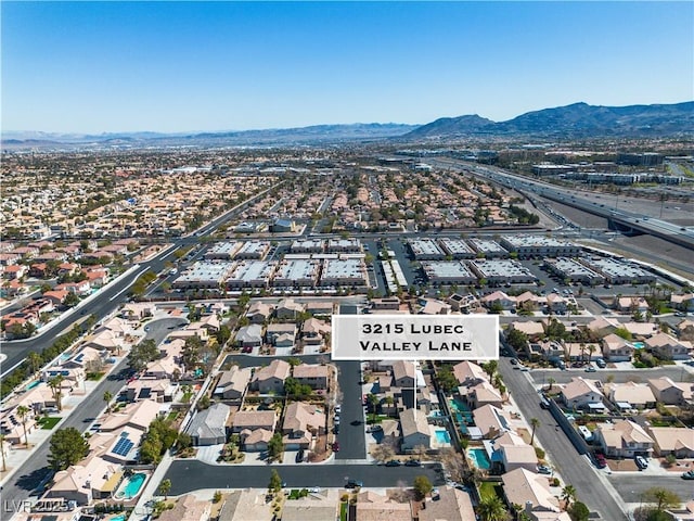 bird's eye view with a residential view and a mountain view