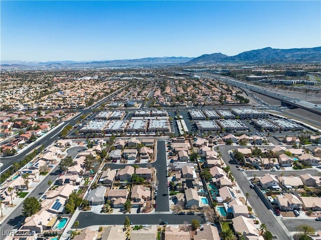 birds eye view of property featuring a mountain view and a residential view