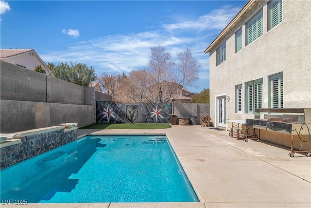 view of swimming pool with a fenced in pool, a fenced backyard, and a patio area