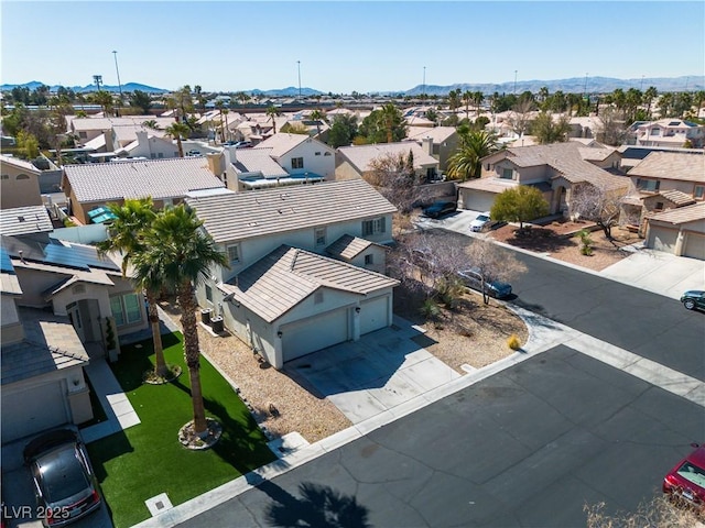 drone / aerial view featuring a mountain view and a residential view