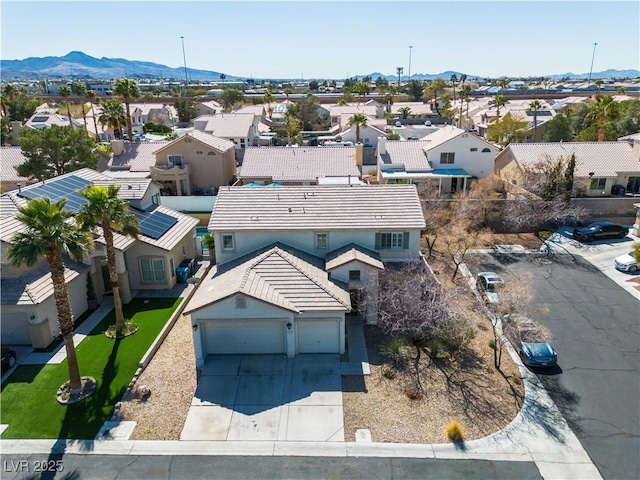 aerial view featuring a mountain view and a residential view