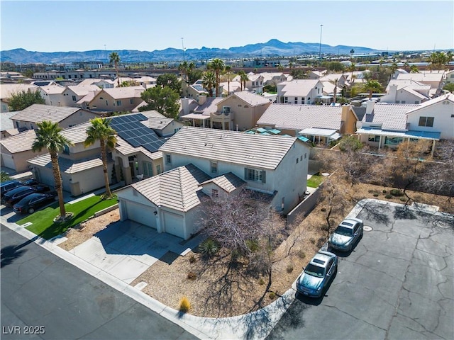 drone / aerial view with a mountain view and a residential view