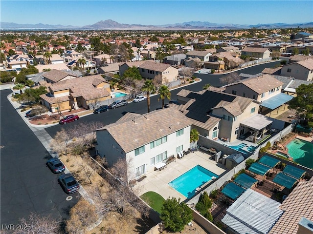 birds eye view of property featuring a mountain view and a residential view