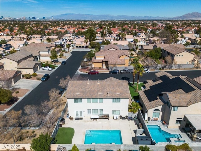 birds eye view of property featuring a mountain view and a residential view