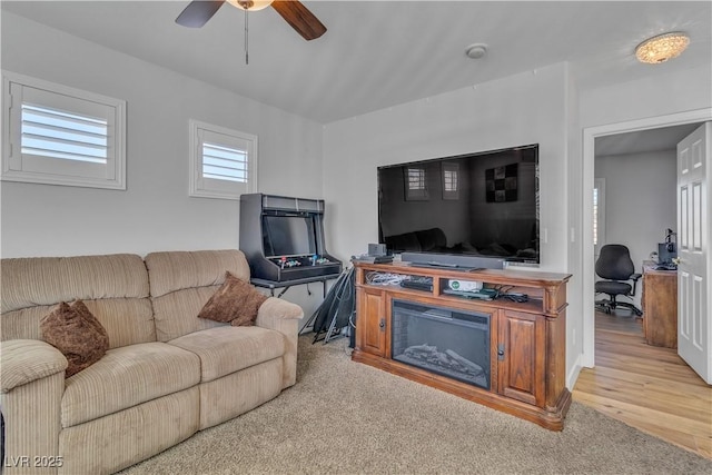 living room featuring wood finished floors and ceiling fan