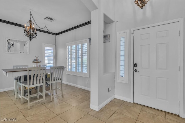 dining area with visible vents, crown molding, baseboards, an inviting chandelier, and light tile patterned flooring