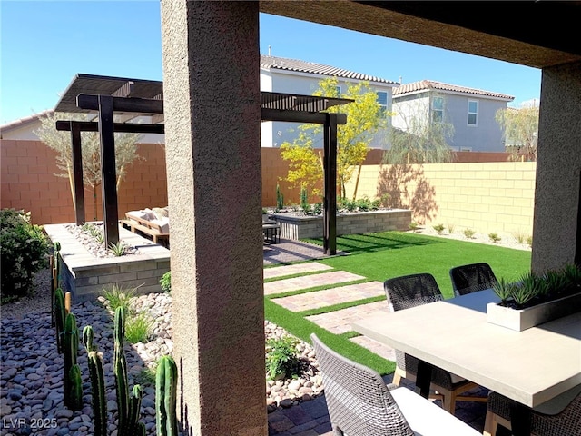 view of patio featuring a fenced backyard, outdoor dining space, and a pergola