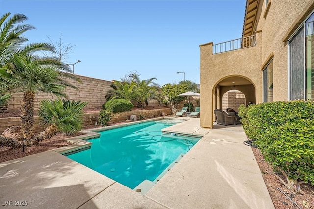 view of pool with a fenced in pool, a patio, and a fenced backyard