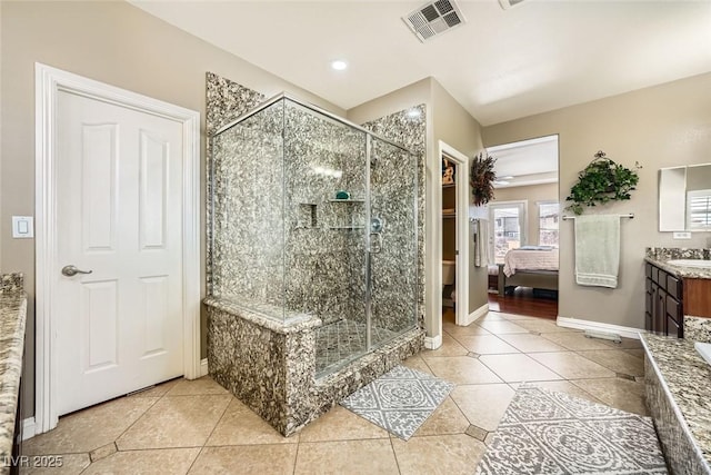 bathroom featuring visible vents, a stall shower, vanity, and tile patterned flooring