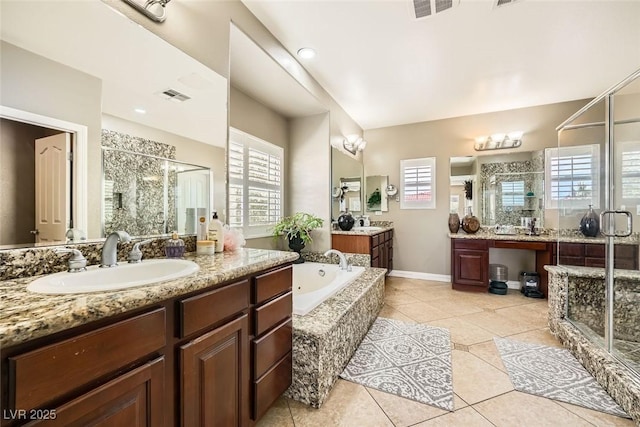 bathroom with tile patterned flooring, visible vents, a stall shower, and a sink