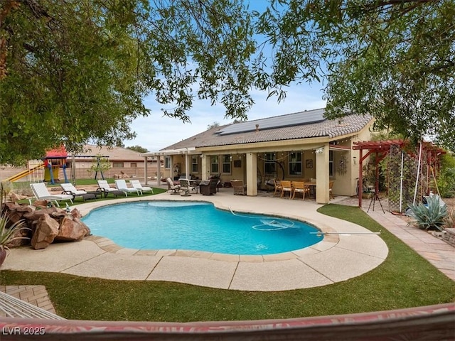 view of swimming pool featuring a fenced in pool, a playground, fence, outdoor dining area, and a patio area