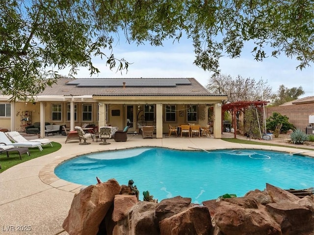 view of pool featuring a patio area, a fenced in pool, outdoor lounge area, and a pergola