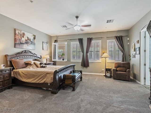 bedroom with ceiling fan, carpet, visible vents, and baseboards