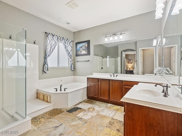 bathroom featuring visible vents, stone finish floor, a shower stall, a bath, and vanity