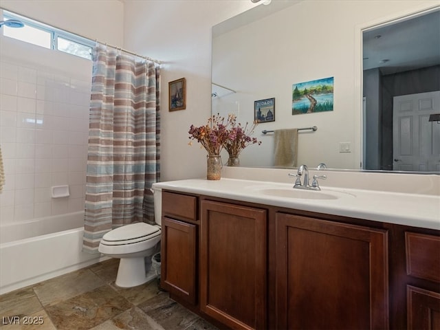 bathroom featuring toilet, shower / tub combo with curtain, and vanity