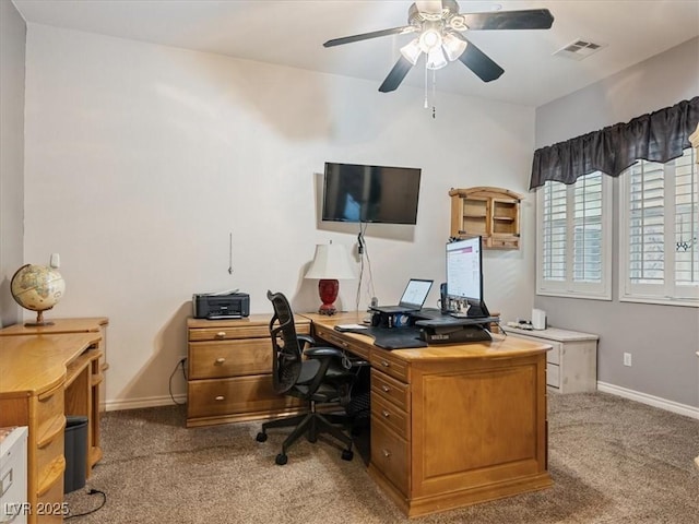 office area featuring light carpet, visible vents, and baseboards