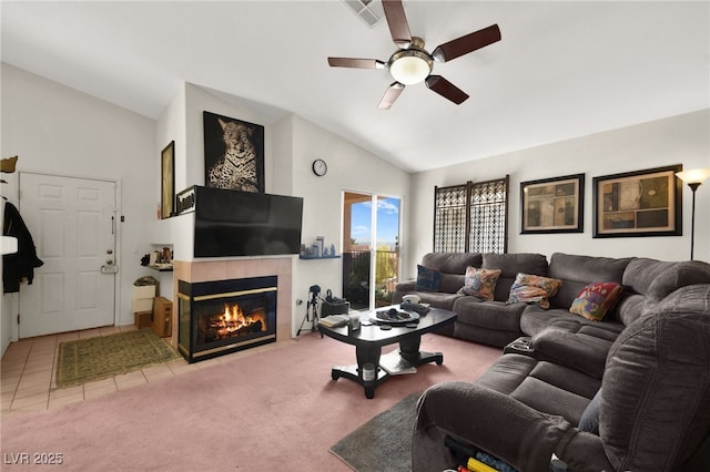 living area with carpet, visible vents, lofted ceiling, a tile fireplace, and tile patterned floors