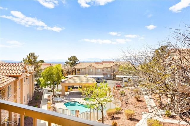 exterior space featuring a gazebo, a fenced backyard, and a residential view