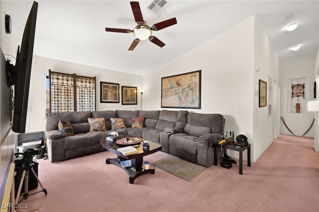 carpeted living area featuring visible vents, a ceiling fan, and vaulted ceiling