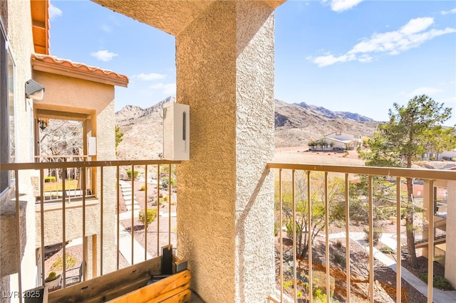 balcony featuring a mountain view