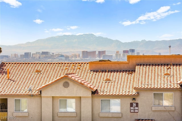 mountain view featuring a view of city