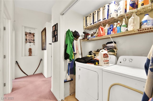 laundry room with laundry area, washer and dryer, and light colored carpet