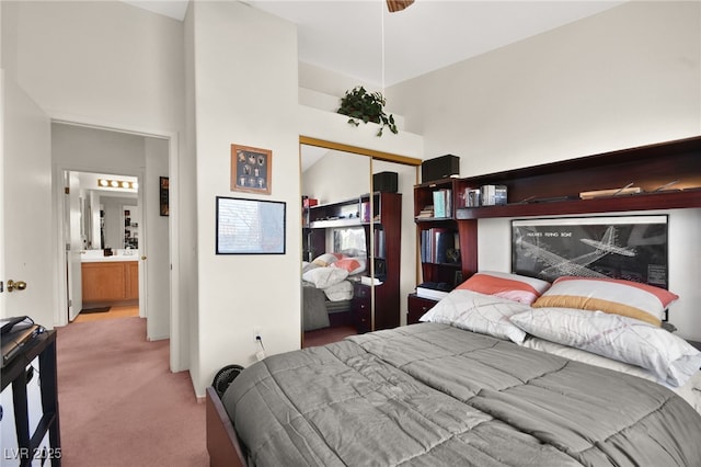 bedroom featuring a closet and light colored carpet