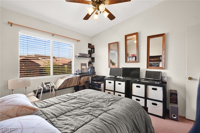 carpeted bedroom with lofted ceiling and ceiling fan