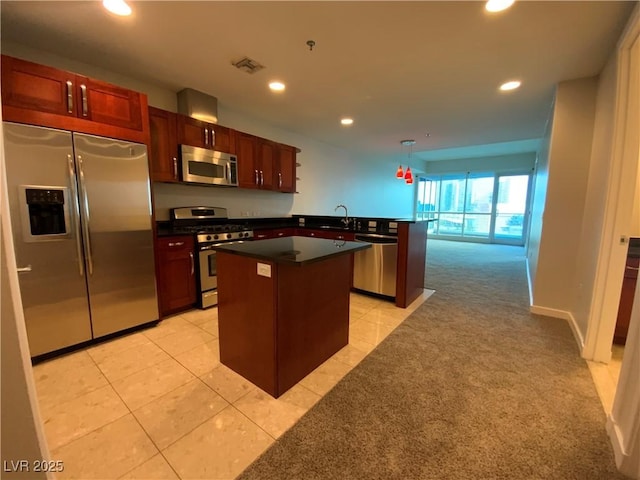 kitchen featuring visible vents, a center island, light carpet, recessed lighting, and appliances with stainless steel finishes