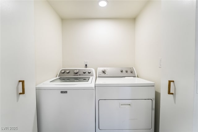 washroom with laundry area and washing machine and dryer