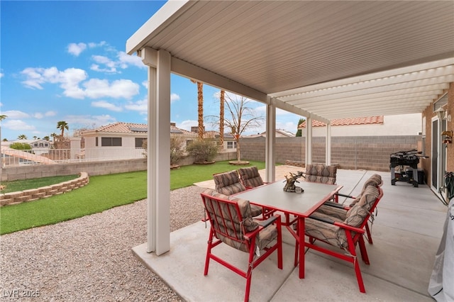 view of patio / terrace featuring a fenced backyard, outdoor dining space, and a pergola