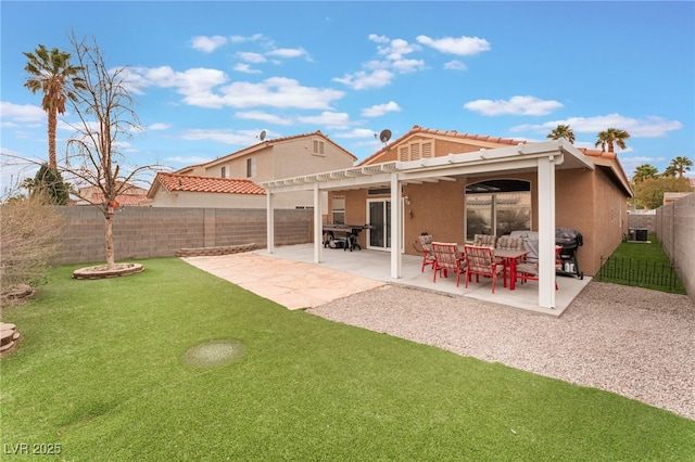 rear view of property featuring stucco siding, a pergola, a fenced backyard, a yard, and a patio area