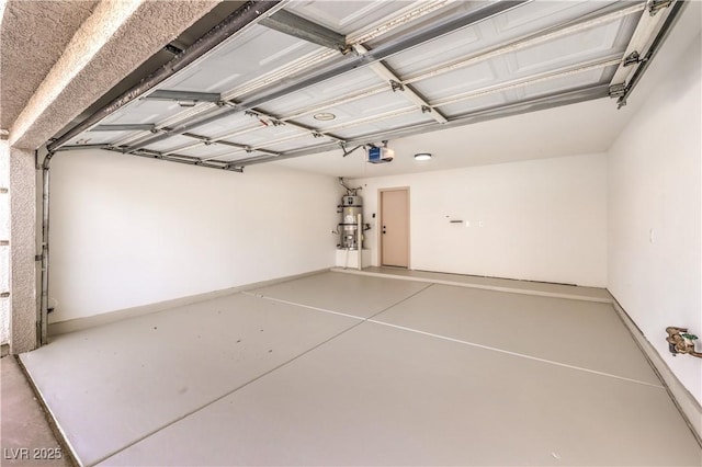 garage with a garage door opener and baseboards