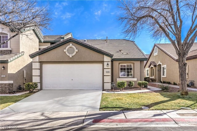 view of front of home featuring a tile roof, an attached garage, driveway, and stucco siding